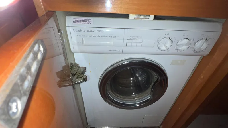 Slide: The Image of Washing machine inside a 2001 Uniesse Flybridge 48 yacht. - 41