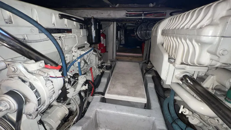Slide: The Image of Engine room of a 2001 Uniesse Flybridge 48 yacht, showcasing mechanical components. - 46
