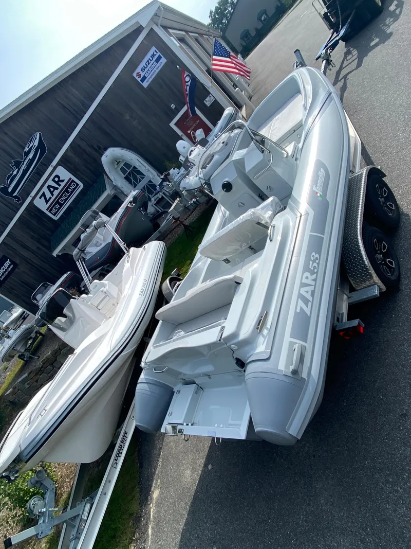Slide: The Image of 2024 Zar Formenti 53 inflatable boat displayed at a dealership. - 6