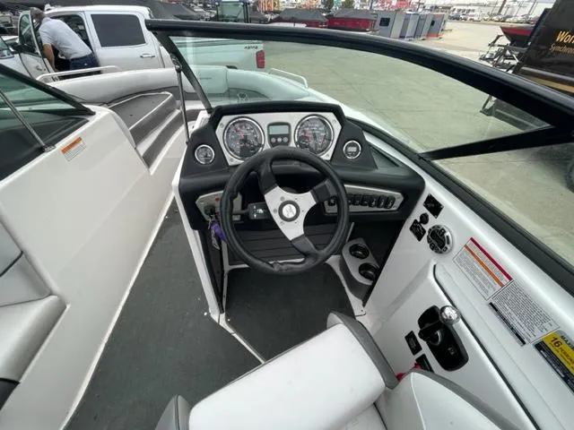 Slide: The Image of 2012 Moomba Mojo 2.5 boat cockpit with steering wheel and dashboard. - 12