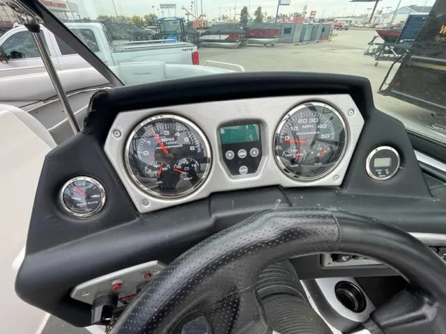 Slide: The Image of 2012 Moomba Mojo 2.5 boat dashboard with gauges and steering wheel. - 15