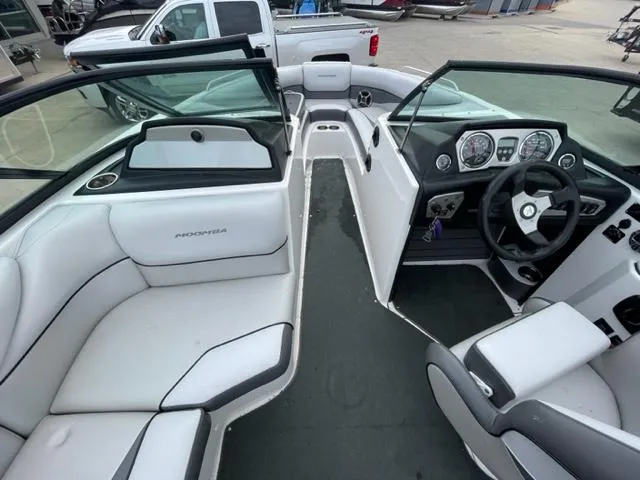 Slide: The Image of 2012 Moomba Mojo 2.5 boat interior with white seating and dashboard. - 16