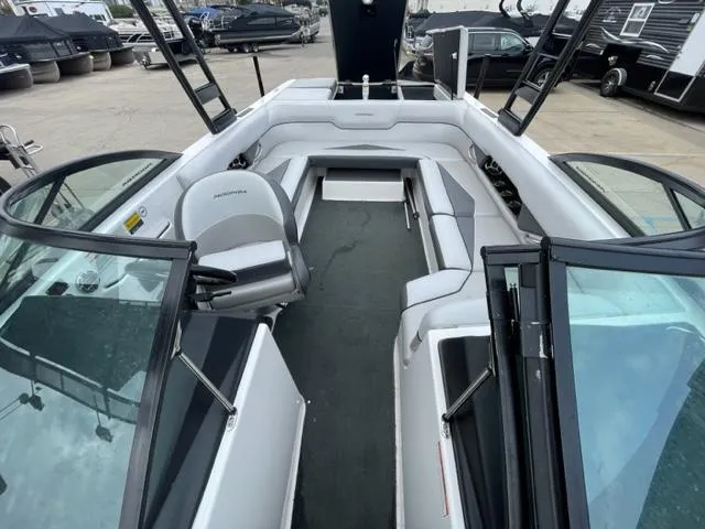 Slide: The Image of 2012 Moomba Mojo 2.5 boat interior with seating and steering wheel. - 19