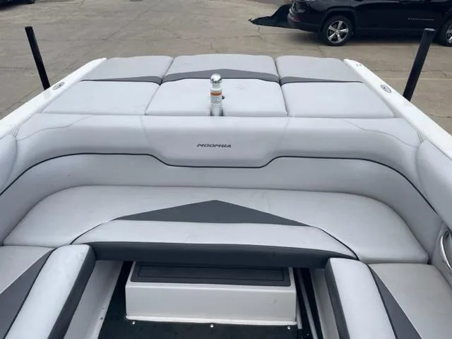 Slide: The Image of 2012 Moomba Mojo 2.5 boat interior with gray and white seating. - 22