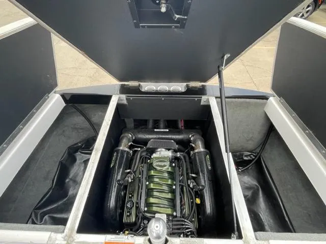 Slide: The Image of 2012 Moomba Mojo 2.5 boat engine compartment with open hatch. - 23