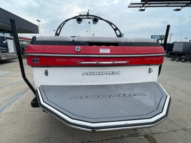 Slide: The Image of 2012 Moomba Mojo 2.5 boat rear view at a dealership. - 3
