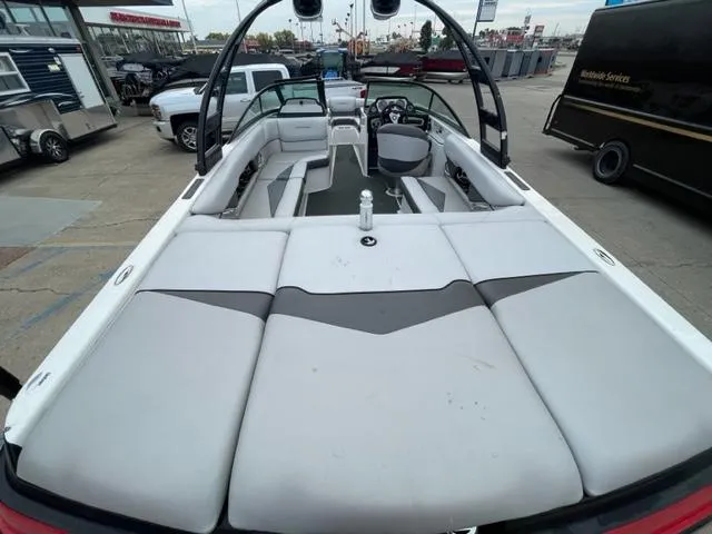 Slide: The Image of 2012 Moomba Mojo 2.5 boat interior with spacious seating and modern dashboard. - 7