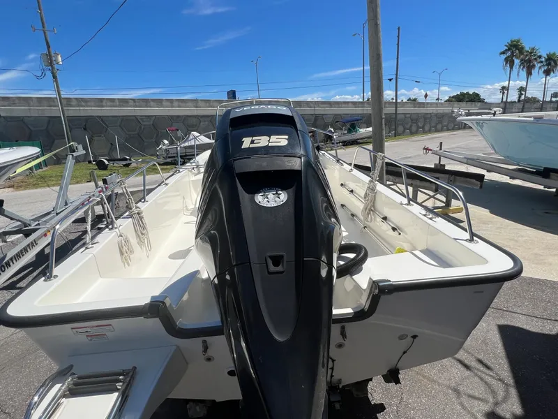 Slide: The Image of 2009 Boston Whaler 190 Outrage boat with 135 HP engine, rear view. - 6