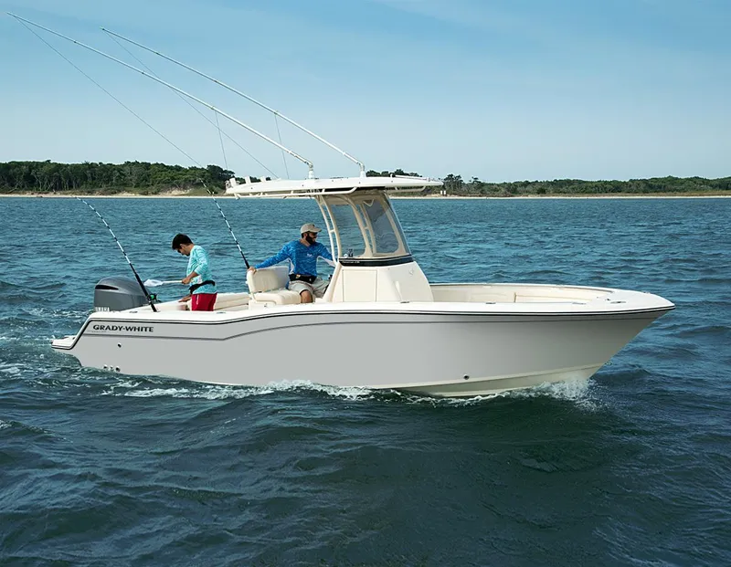 The Image of 2024 Grady-White 236 boat cruising on open water with two people fishing. - 1