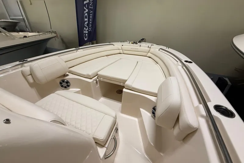 Slide: The Image of 2026 Grady-White Fisherman 236 boat interior with white seating and modern design. - 10