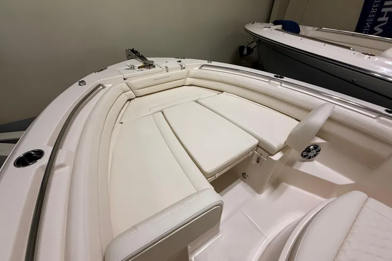 Slide: The Image of 2026 Grady-White Fisherman 236 boat interior with cushioned seating and sleek design. - 11