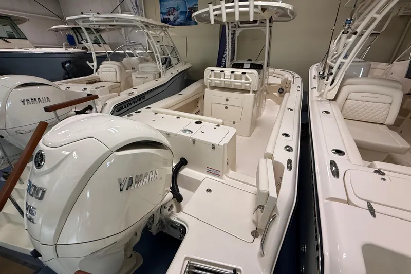 Slide: The Image of 2026 Grady-White Fisherman 236 boat with Yamaha outboard engines in showroom. - 4