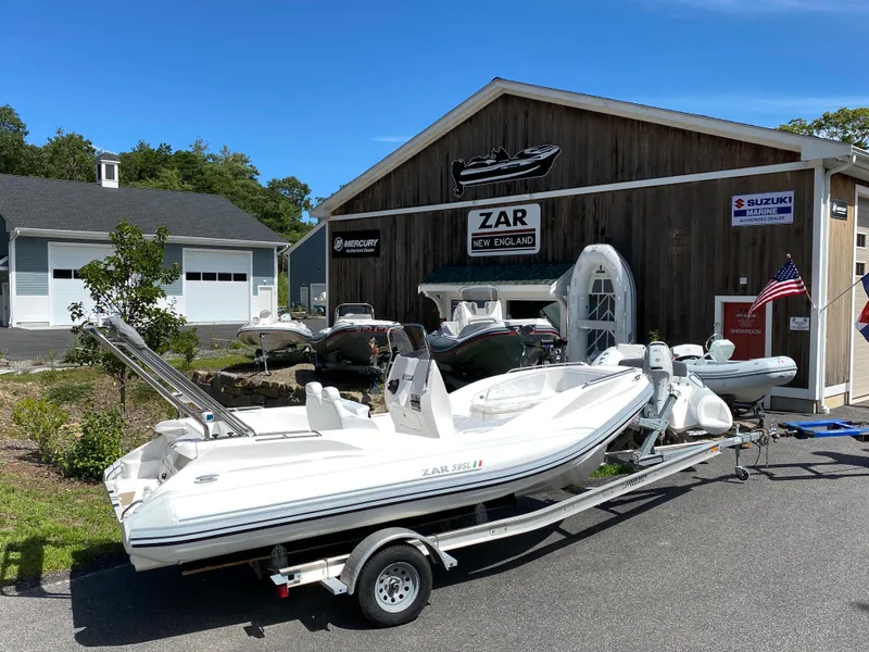 The Image of 2024 Zar Formenti 59 SL Limited boat on trailer outside dealership. - 1