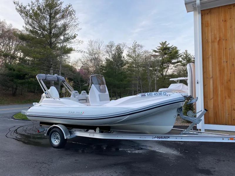 Slide: The Image of 2024 Zar Formenti 59 SL Limited boat on trailer in outdoor setting. - 4