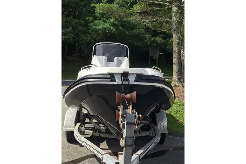 Slide: The Image of 2024 Zar Formenti 59 SL boat on trailer, parked outdoors. - 7