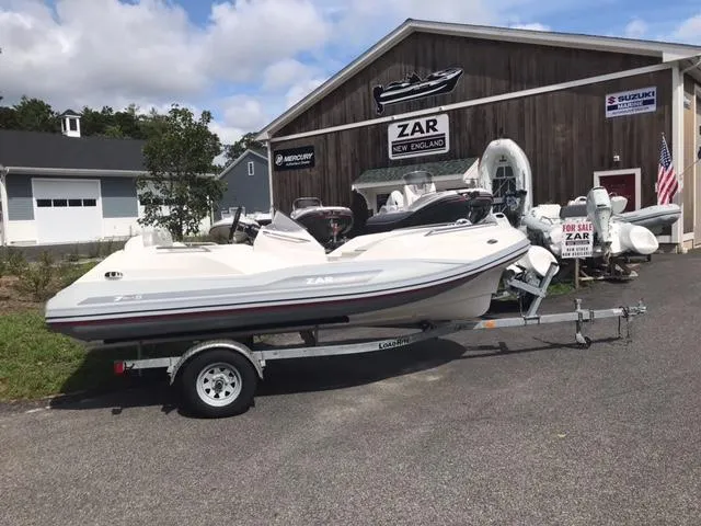 Slide: The Image of 2024 Zar Formenti Tender ZF-5 boat on a trailer outside a dealership. - 6