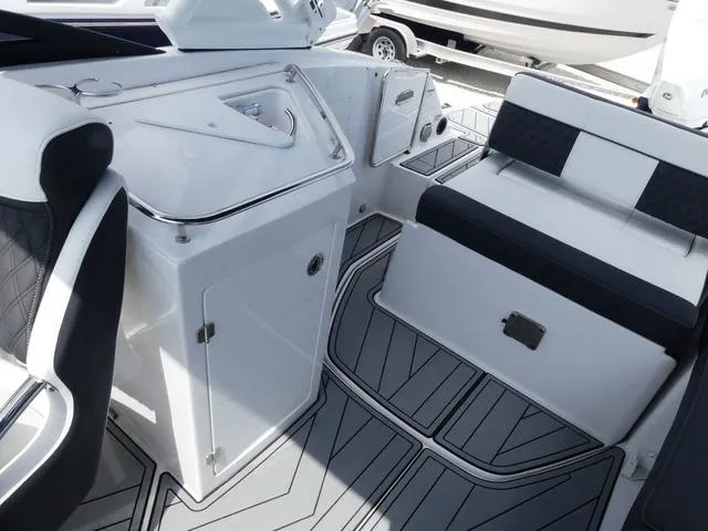 Slide: The Image of 2024 Monterey M-65 boat interior with sleek seating and modern design. - 16