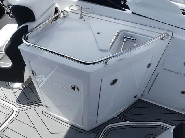 Slide: The Image of 2024 Monterey M-65 boat interior with sleek white cabinetry and modern design. - 17