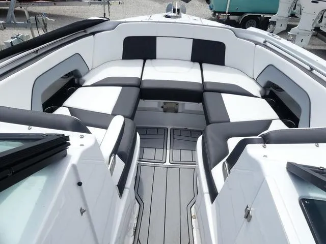 Slide: The Image of 2024 Monterey M-65 boat interior with sleek white and black seating. - 18