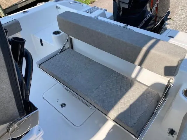 Slide: The Image of 2024 Sea Pro 242 Center Console boat on trailer in showroom. - 12