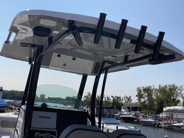 Slide: The Image of 2024 Sea Pro 242 DLX boat with outboard motor, rear view. - 14