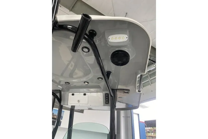 Slide: The Image of 2024 Sea Pro 242 Center Console boat's overhead console with lighting and speaker. - 28