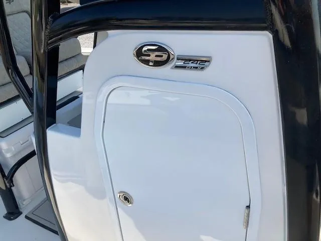 Slide: The Image of 2024 Sea Pro 242 DLX boat console with storage compartment. - 32