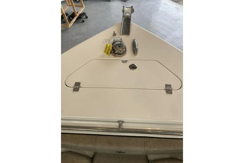 Slide: The Image of 2024 Sea Pro 242 Center Console boat deck with storage hatch and accessories. - 38
