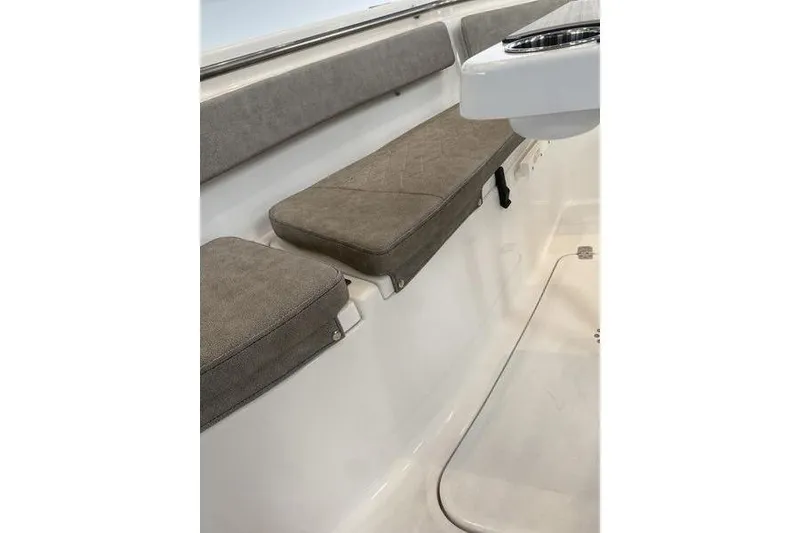Slide: The Image of 2024 Sea Pro 242 Center Console boat interior with cushioned seating. - 47