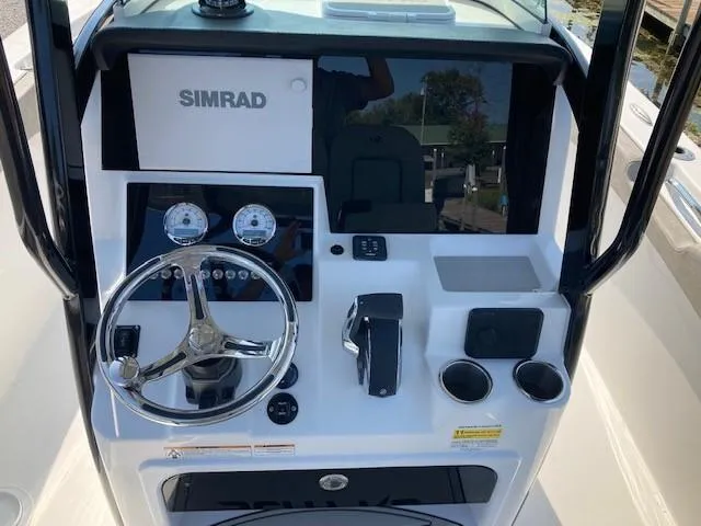 Slide: The Image of 2024 Sea Pro 242 Center Console boat on trailer in indoor showroom. - 6