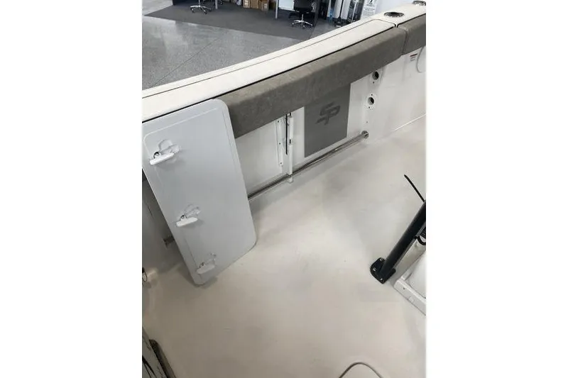 Slide: The Image of 2024 Sea Pro 242 Center Console boat interior with storage compartment and seating. - 63