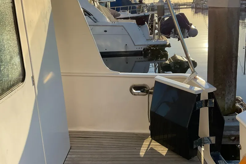 Slide: The Image of Integrity 45 yacht, 2012 model, docked at marina during sunset. - 10