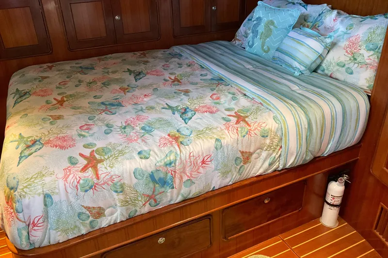 Slide: The Image of Cozy bedroom in 2012 Integrity 45 boat with ocean-themed bedding. - 22