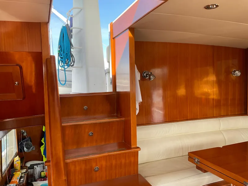 Slide: The Image of Interior of 2012 Integrity 45 yacht with wooden stairs and seating area. - 24