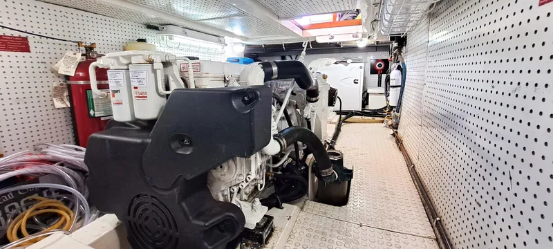 Slide: The Image of Engine room of a 2012 Integrity 45 yacht with visible machinery and equipment. - 30