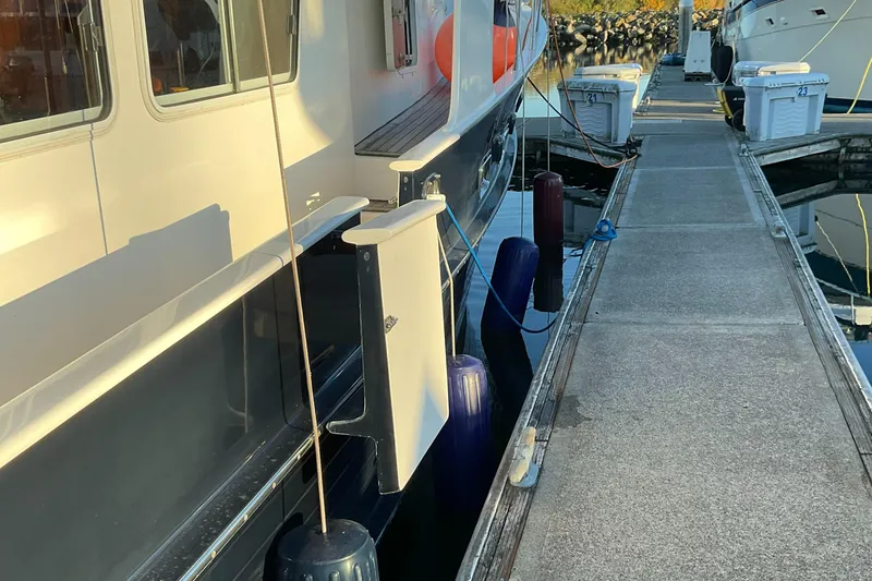 Slide: The Image of Integrity 45 2012 yacht docked at marina with fenders and dock equipment. - 6