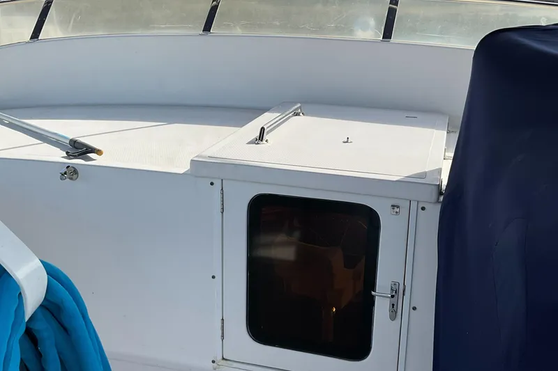 Slide: The Image of Interior view of 2012 Integrity 45 boat with white cabin and blue seating. - 8