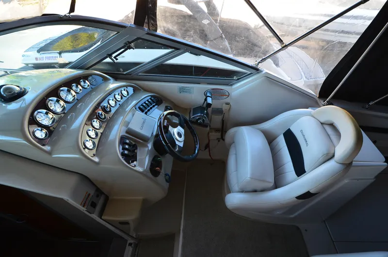 Slide: The Image of 2000 Chaparral Signature 270 boat cockpit with steering wheel and control panel. - 10