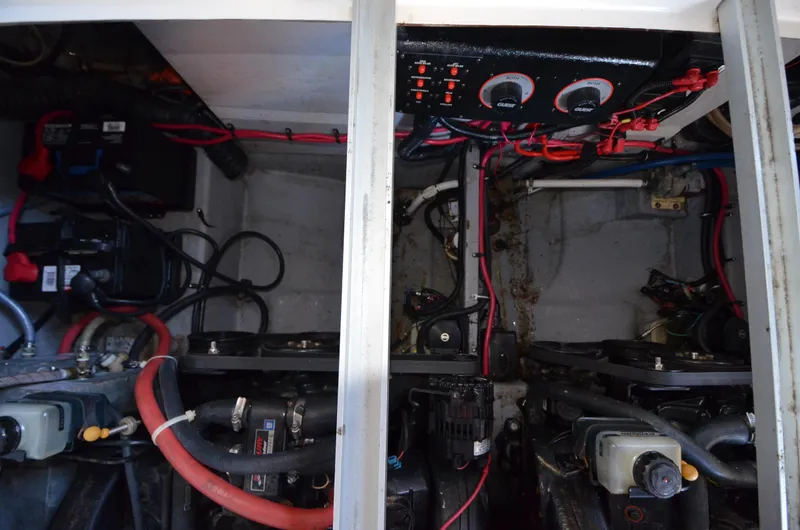 Slide: The Image of Engine compartment of a 2000 Chaparral Signature 270 boat, showing wiring and mechanical components. - 19