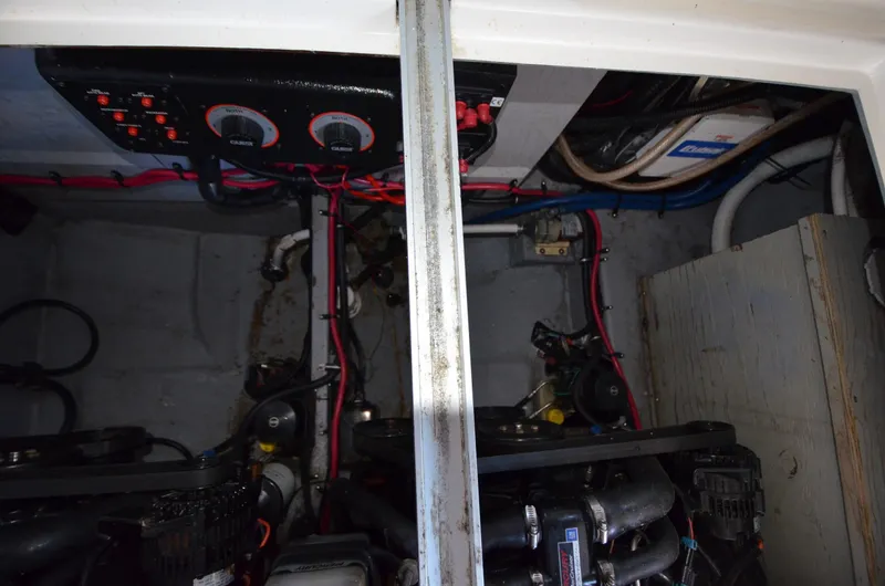 Slide: The Image of Engine compartment of a 2000 Chaparral Signature 270 boat, showing wiring and mechanical components. - 20