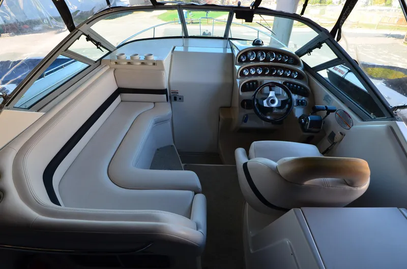 Slide: The Image of 2000 Chaparral Signature 270 boat interior with steering wheel and seating area. - 6