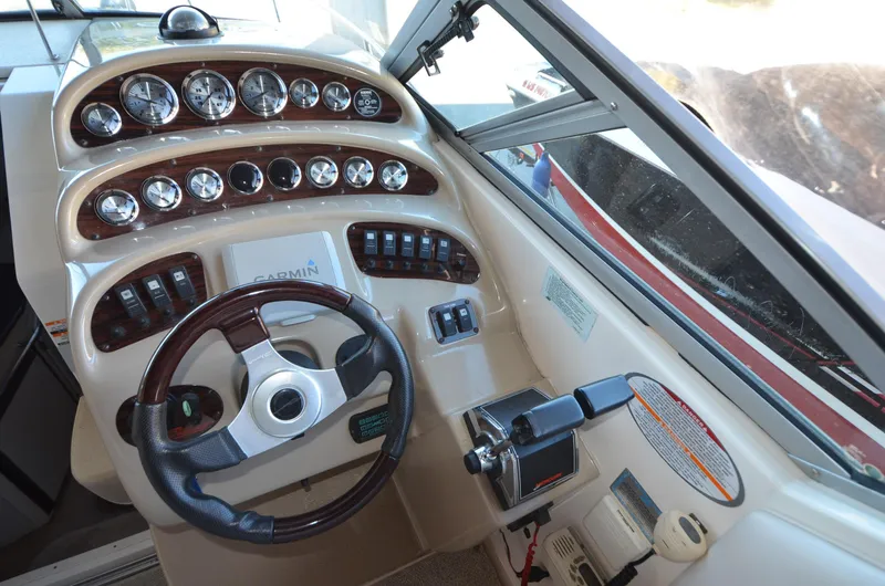 Slide: The Image of Cockpit of 2000 Chaparral Signature 270 boat with steering wheel and instrument panel. - 8