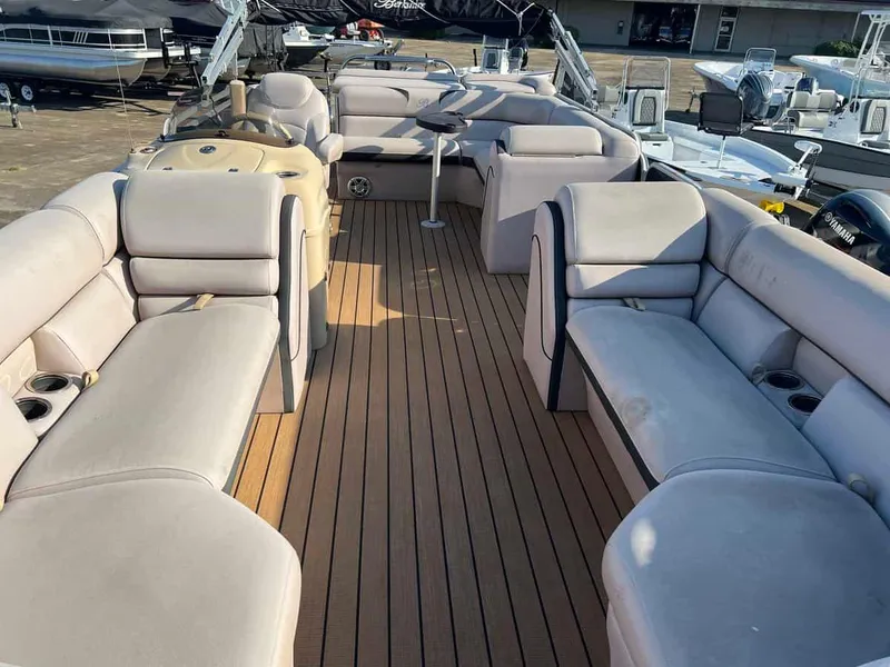 Slide: The Image of 2015 Berkshire 230 CL pontoon boat with spacious seating and wooden deck. - 4