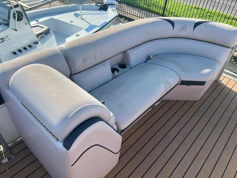 Slide: The Image of 2015 Berkshire 230 CL boat with beige seating on deck. - 6