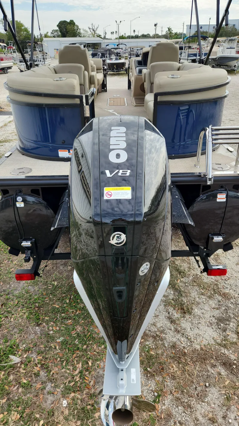 Slide: The Image of 2024 Regency 230 LE3 pontoon boat with powerful V8 engine. - 2