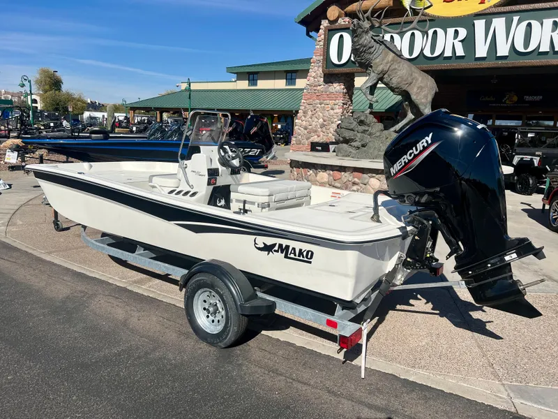 Slide: The Image of 2024 Mako Pro Skiff 17 CC boat on trailer outside Outdoor World. - 4