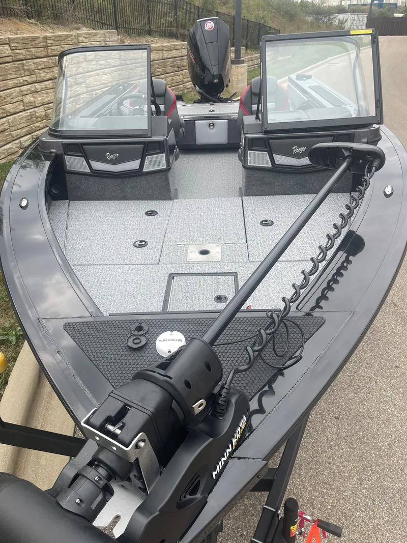 Slide: The Image of 2024 Ranger VX1888 WT fishing boat with dual windshields and trolling motor. - 2