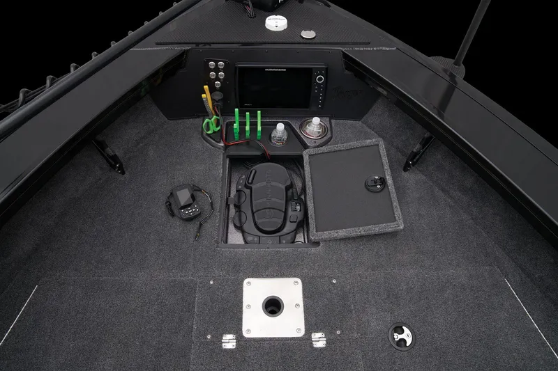 Slide: The Image of 2024 Ranger VX1888 WT boat cockpit with control panel and storage compartments. - 20