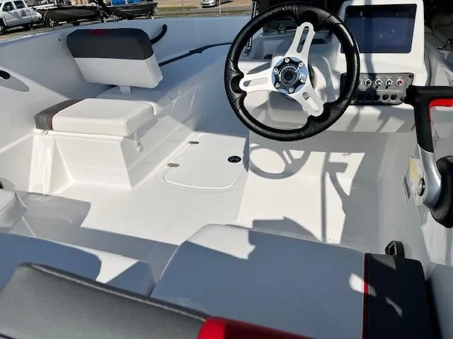 Slide: The Image of 2024 Tahoe T16 boat interior with steering wheel, seating, and control panel. - 3