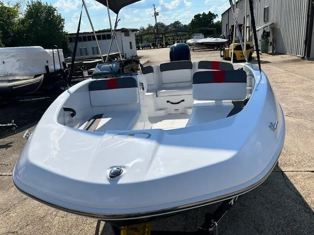 Slide: The Image of 2024 Tahoe T16 boat with seating, docked outdoors. - 5